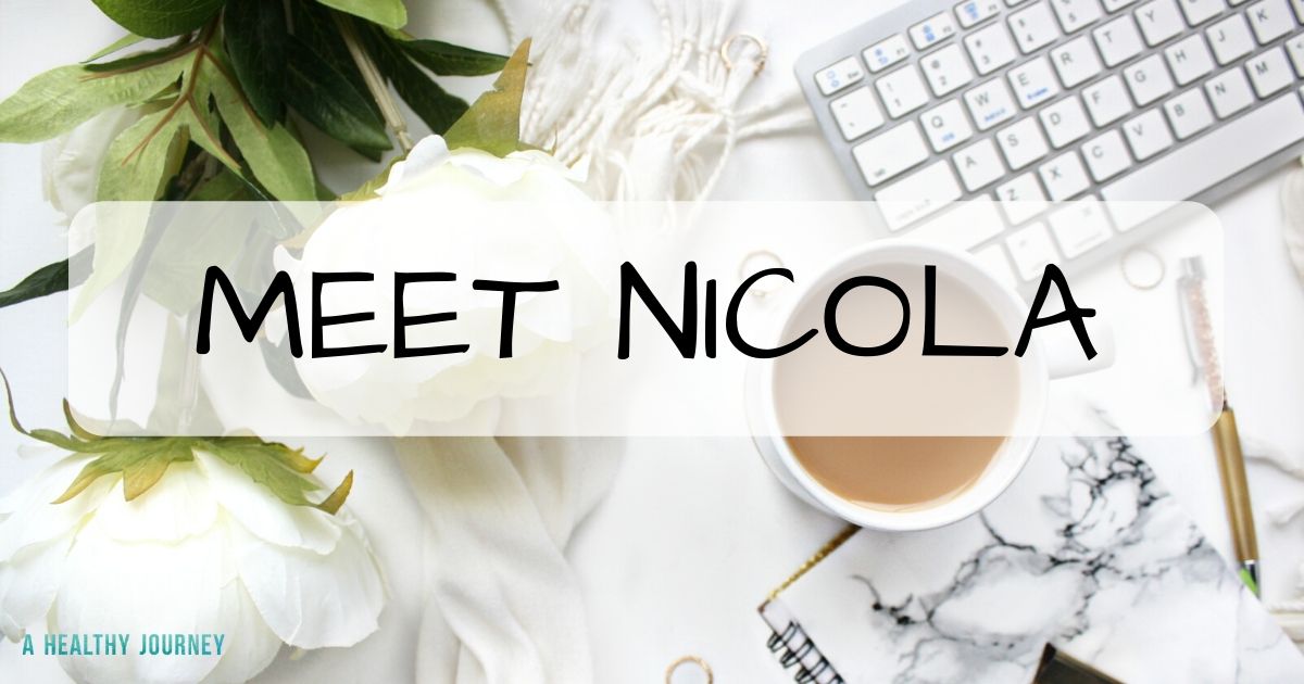 White Tabletop with cup of coffee, keyboard & flowers with text overlay stating Meet Nicola